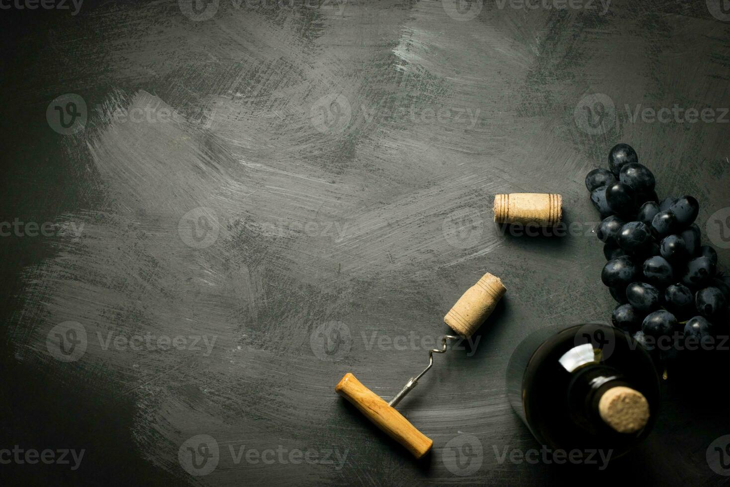 Red wine bottle on a wooden background photo