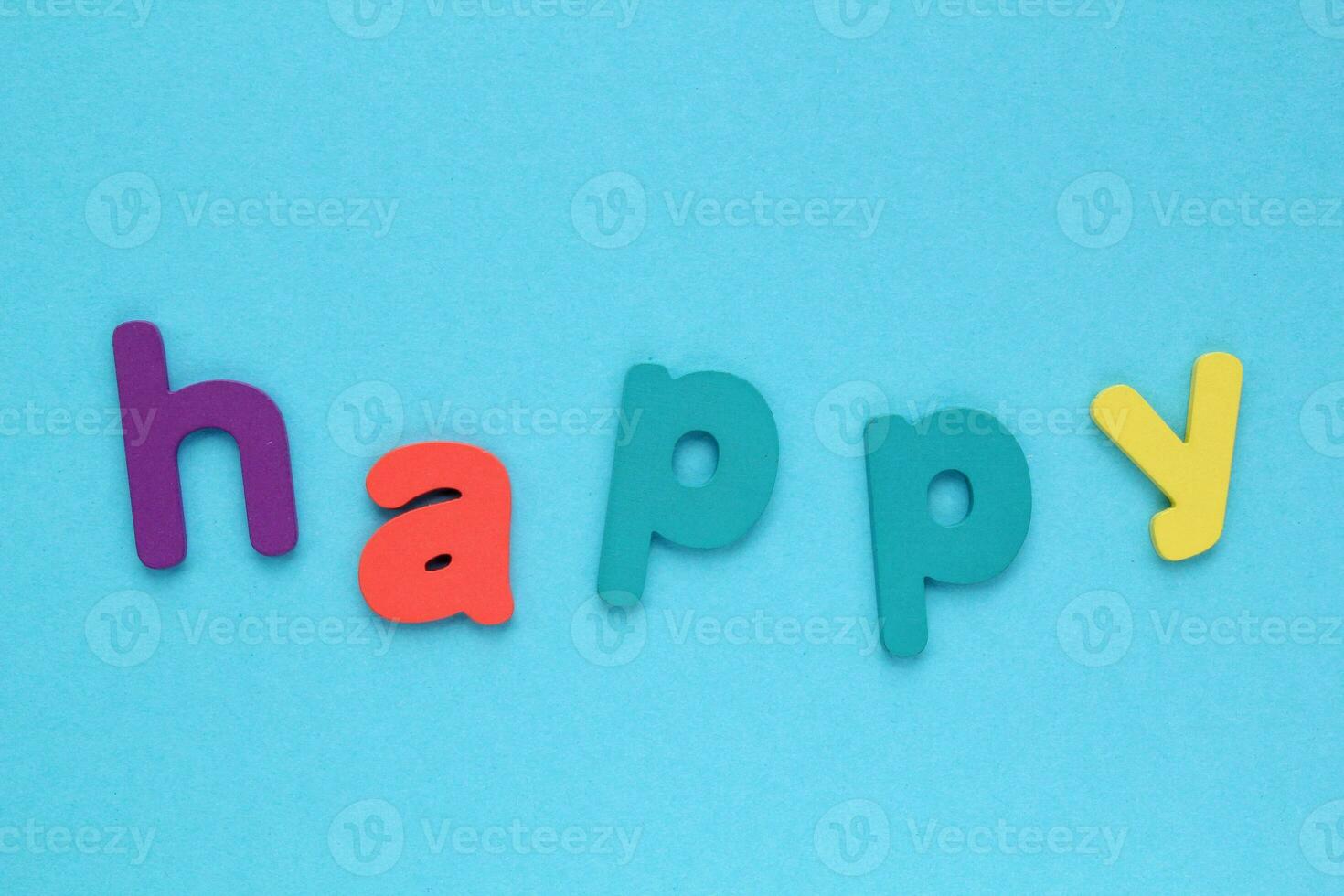 Colorful letters with word Happy on blue background. Design of card. photo