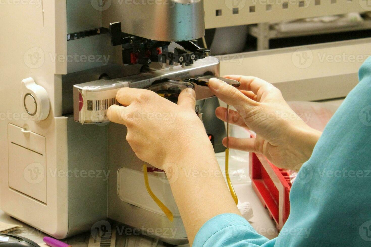 Factory for making spectacle lenses and frames, myopia glasses, sunglasses, production line. Close-up of technician manufacturing lens. Hands of a master in optics salon and repair shop photo