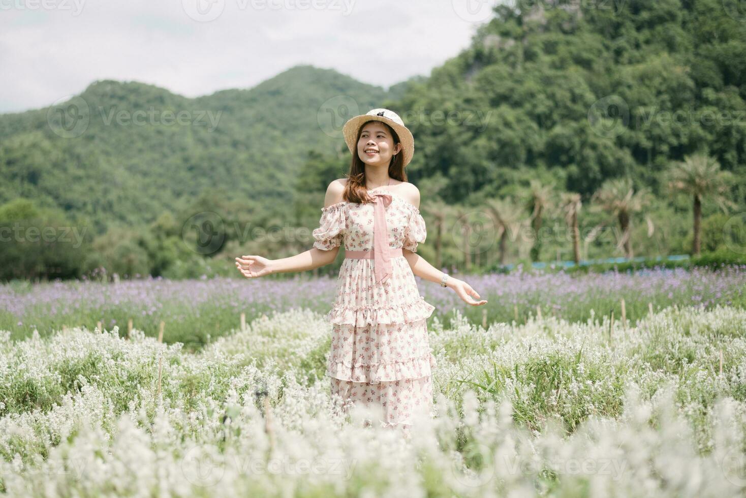 Young woman with bouquet in lavender field photo