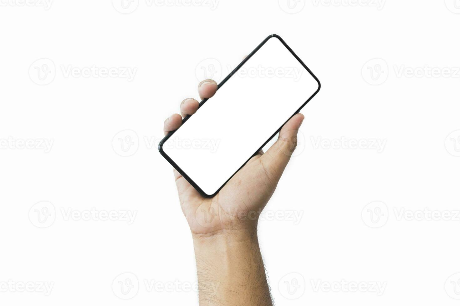 Male hand holding black smartphone with blank screen and modern frameless design two positions angled copy space isolated on white background. close-up hand of man hold mobile phone. Space for text. photo