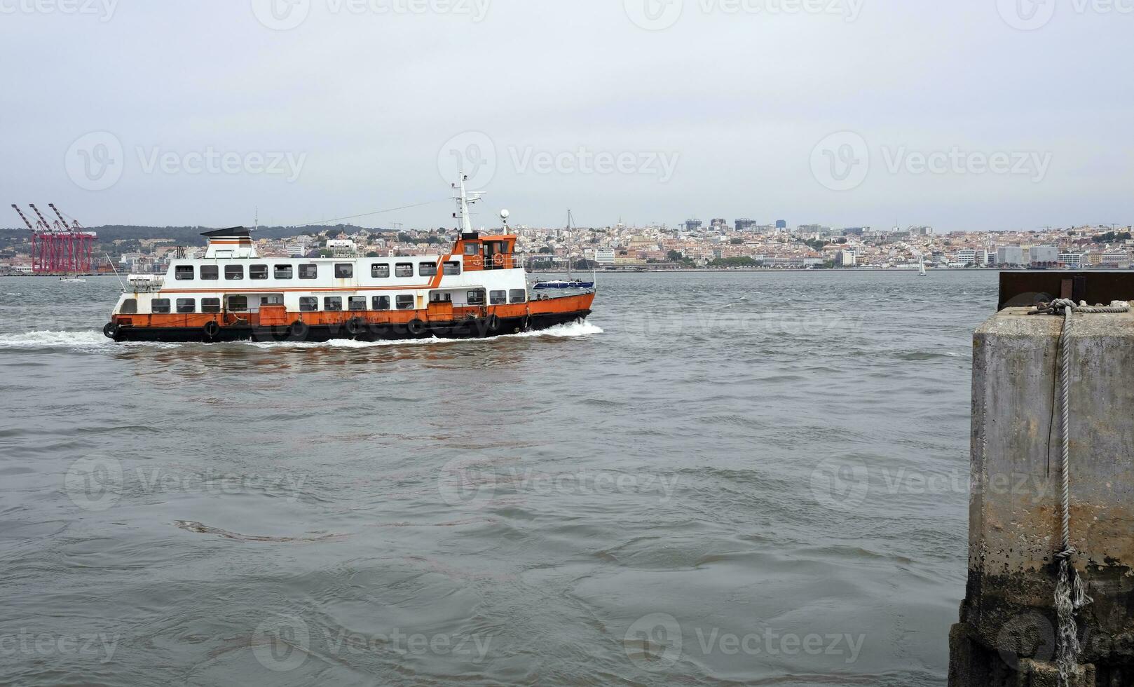 Old rusty ferry boat in Lisbon, Portugal photo