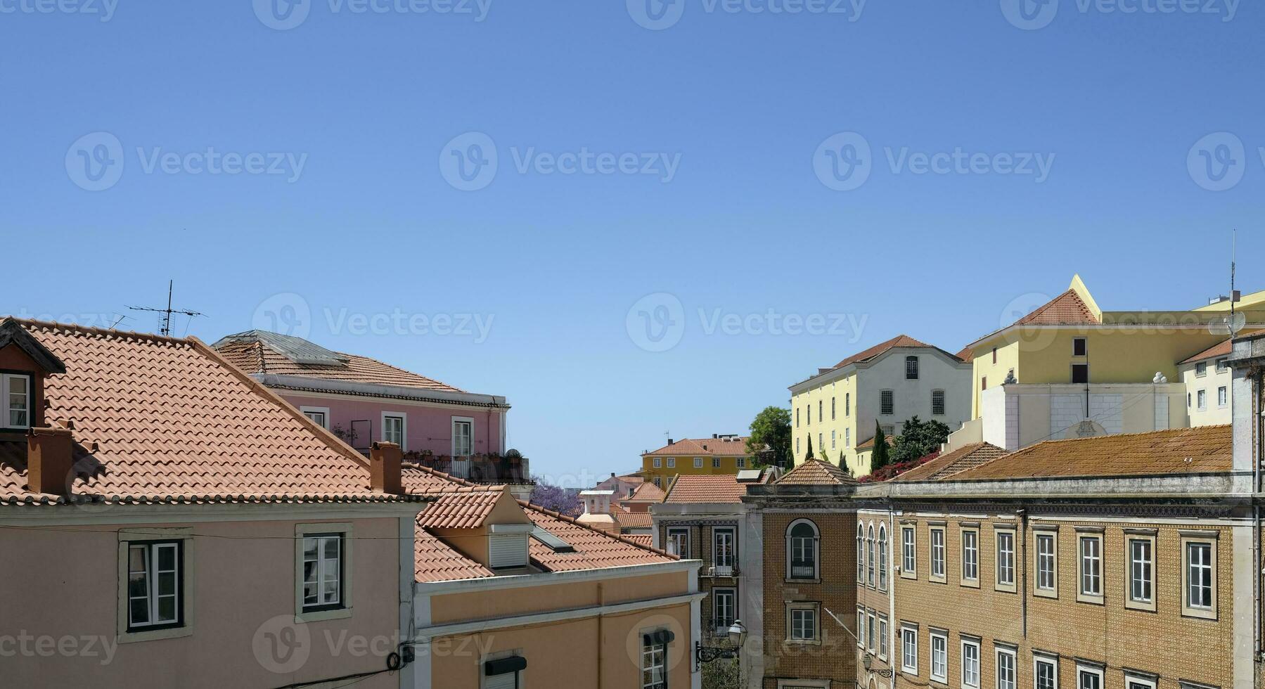 Buildings and roof tops in Lisbon in the afternon hours with clear sky photo