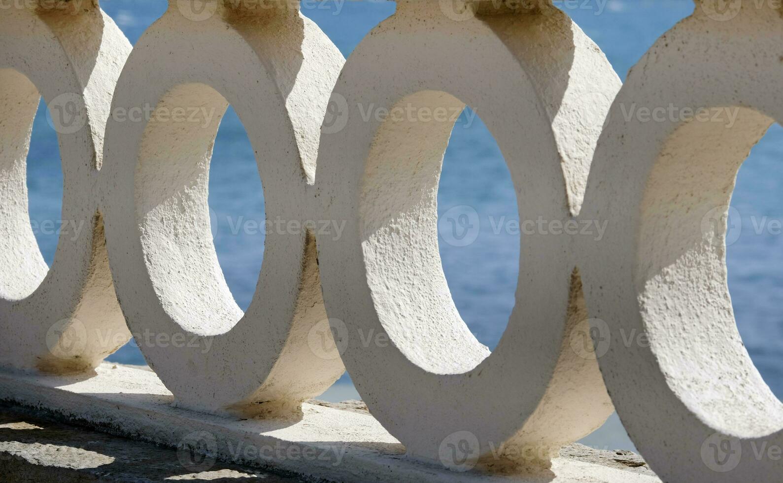 Stone fence next to the coast of Ericeira, Portugal photo