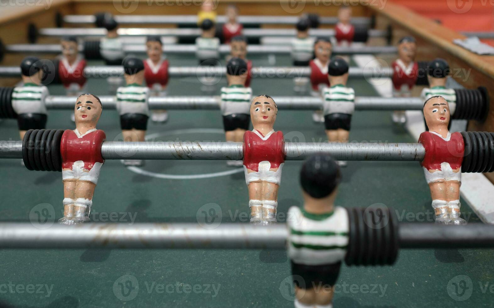 Figurines on a vintage foosball table photo