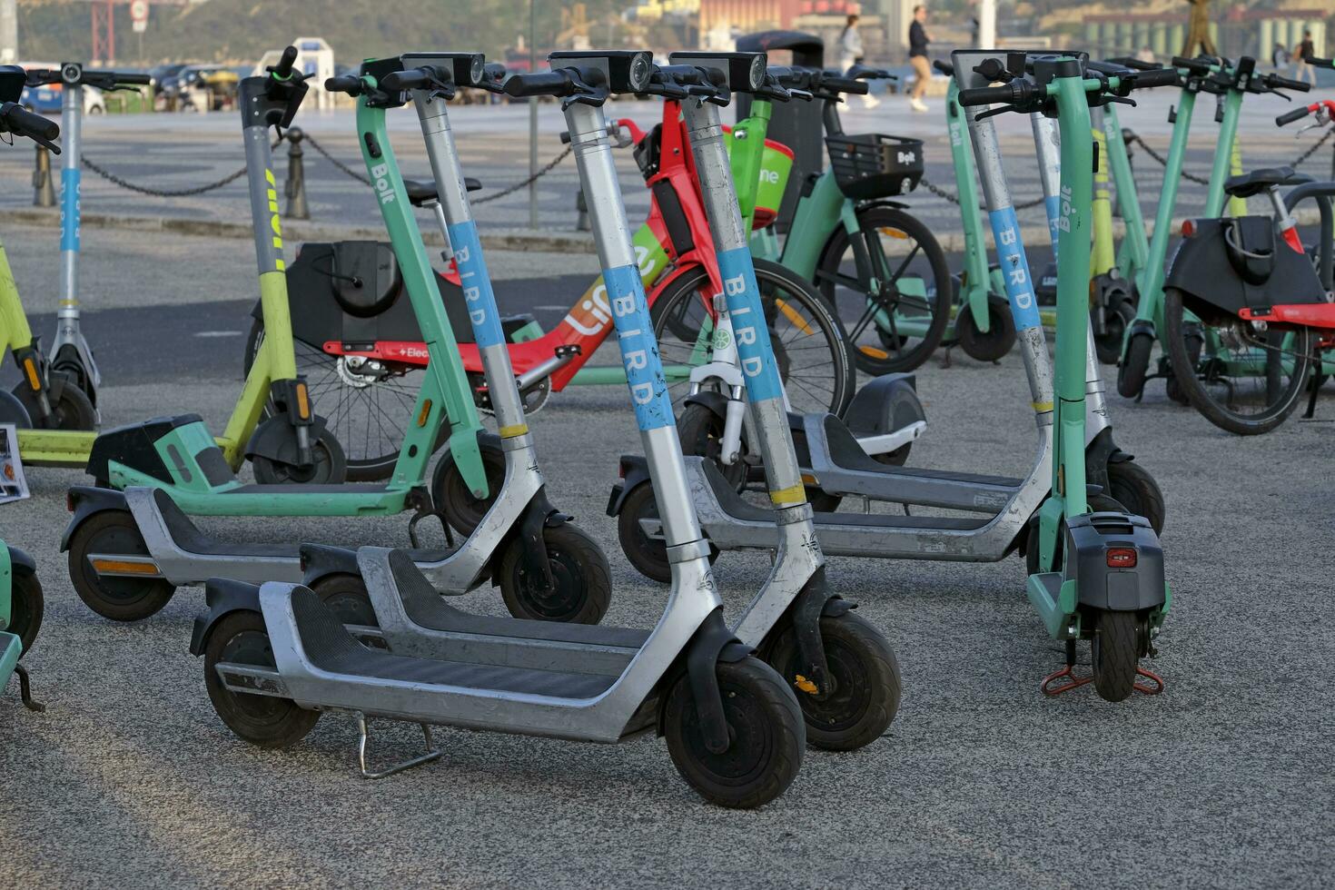Lisbon, Portugal - 13 May 2023 - Numerous scooters parked near the coast in Lisbon. photo