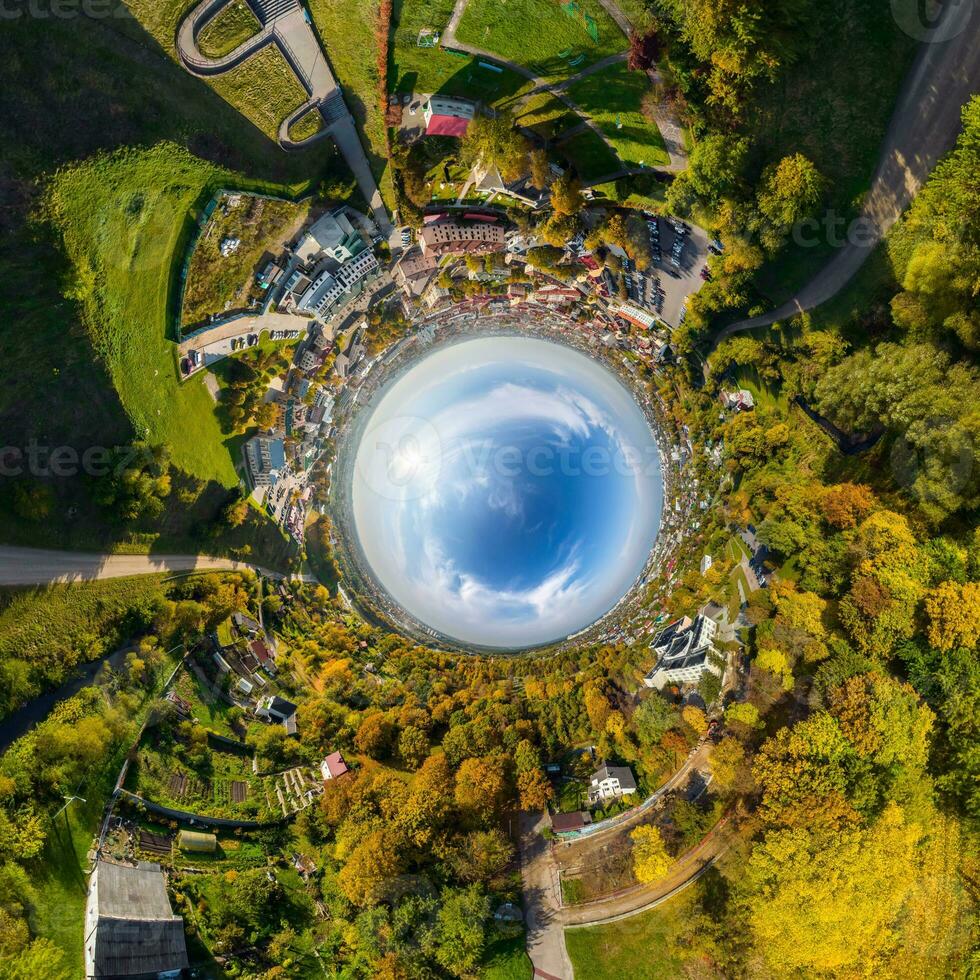 blue sphere inside overlooking old town, urban development, historic buildings and crossroads. Transformation of spherical 360 panorama in abstract aerial view. photo