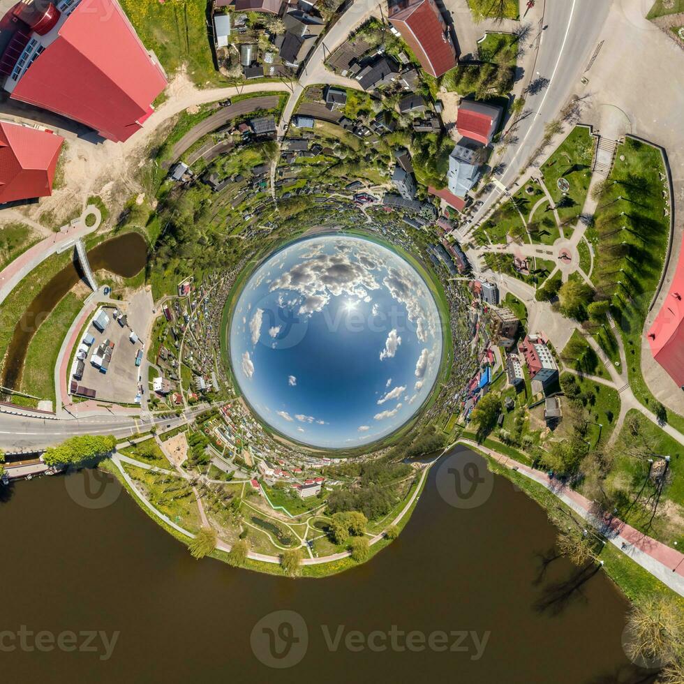 blue sphere inside overlooking old town, urban development, historic buildings and crossroads. Transformation of spherical 360 panorama in abstract aerial view. photo