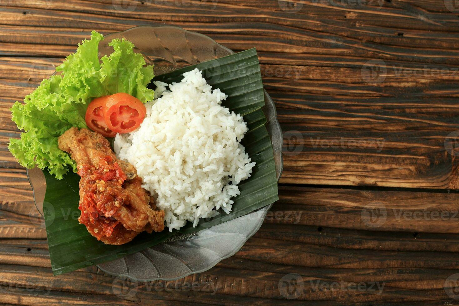 Ayam Geprek Sambal BAwang with Steamed White Rice. photo