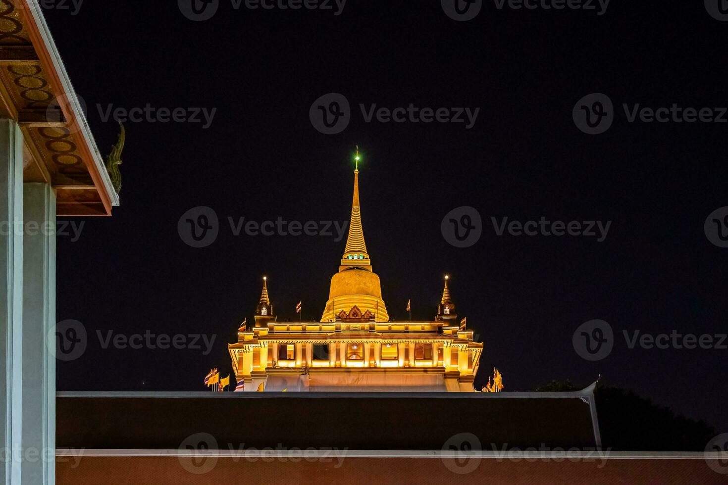 Beautiful sunset at Golden mountain phu khao thong an ancient pagoda at Wat Saket temple on January 29, 2023. The famous destination in Bangkok, Thailand. photo