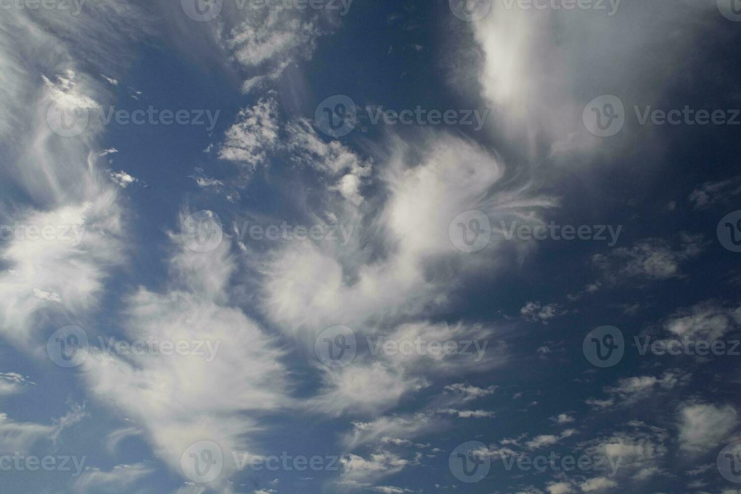 blue sky with white original clouds forming an interesting pattern photo