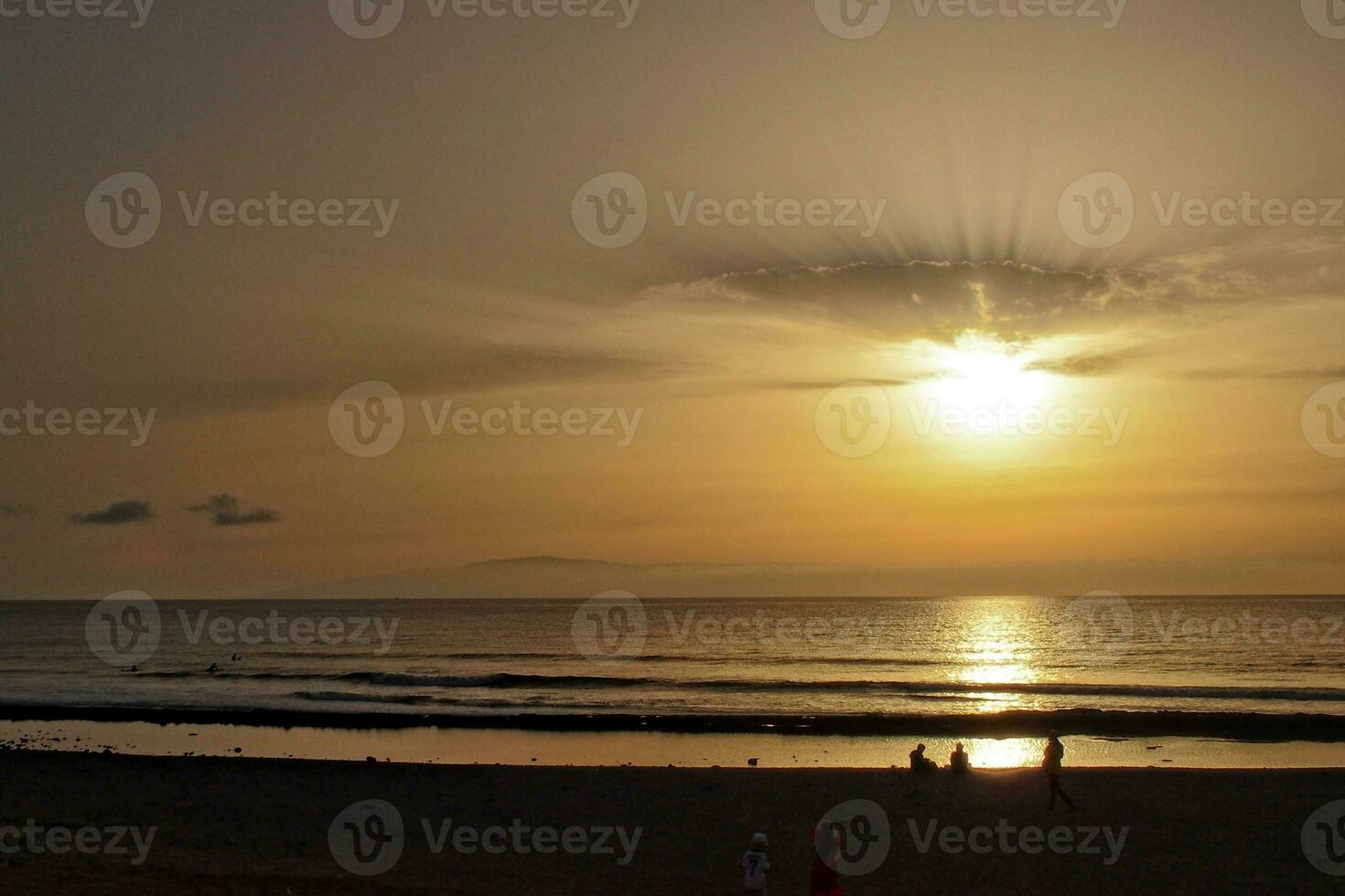 picturesque ocean landscape with the setting sun in a tropical country during summer holidays photo