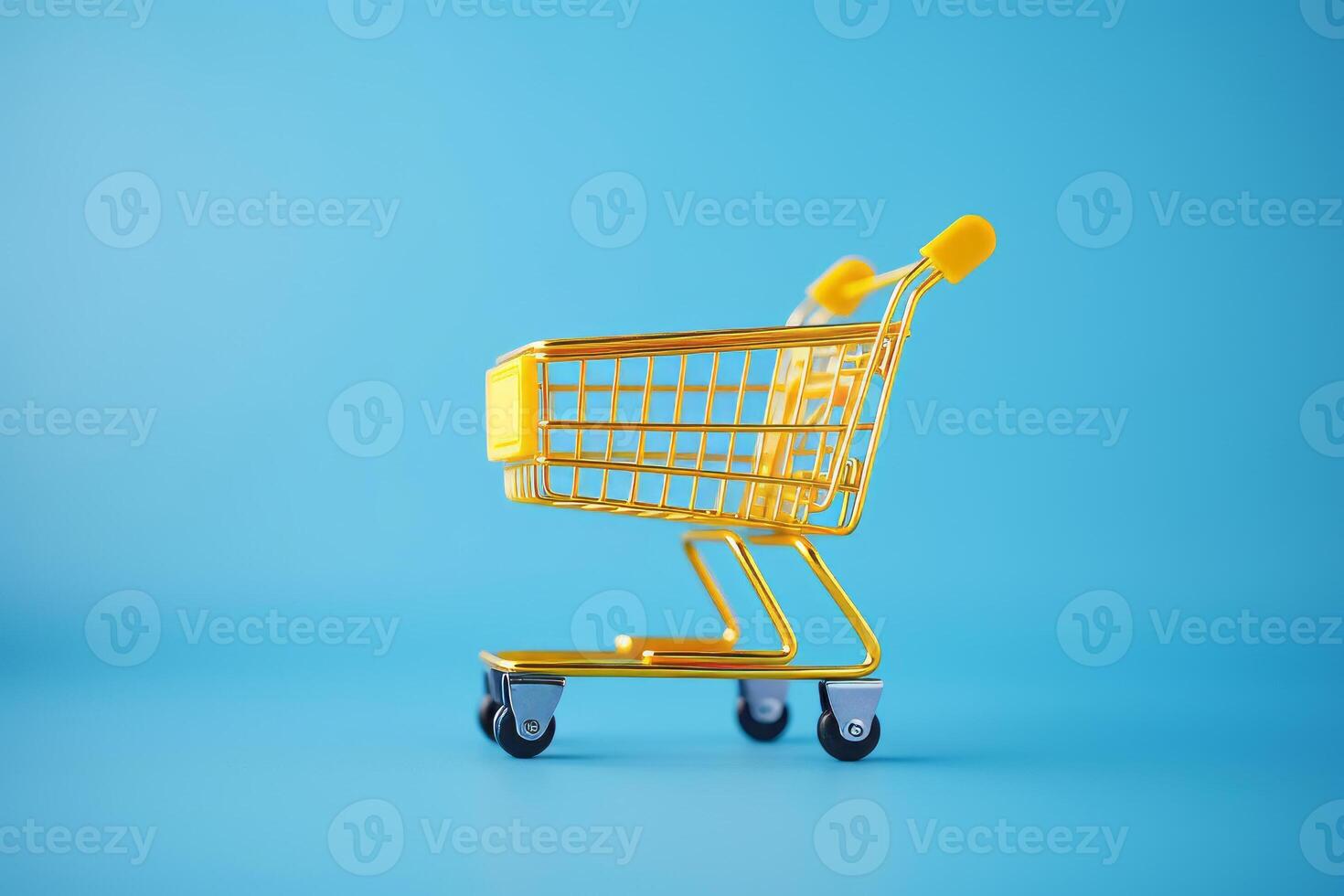 yellow shopping cart on blue background. photo