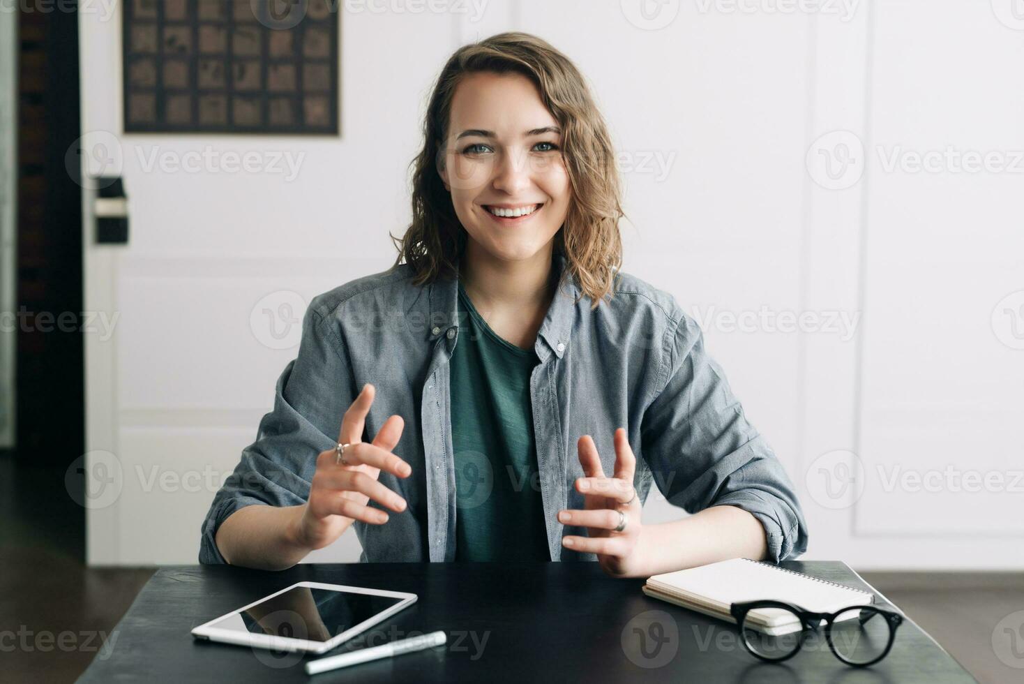 Confident Businesswoman Engaging in a Video Conference, Communicating through Web Camera from Office or Home. Professional and Modern Business Communication Concept. photo