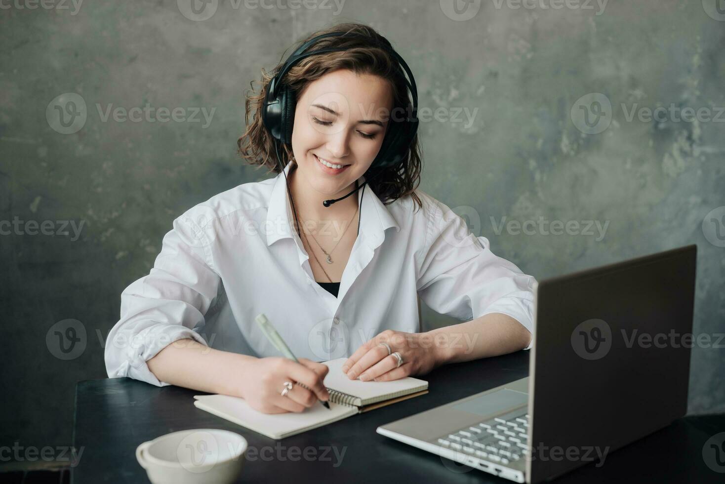 Empowering Distance Learning. Woman Engaged in E-Learning with Laptop at Home. Student's Productive Environment for Work or Study from Home, Business, Creativity, and Online Meetings. photo