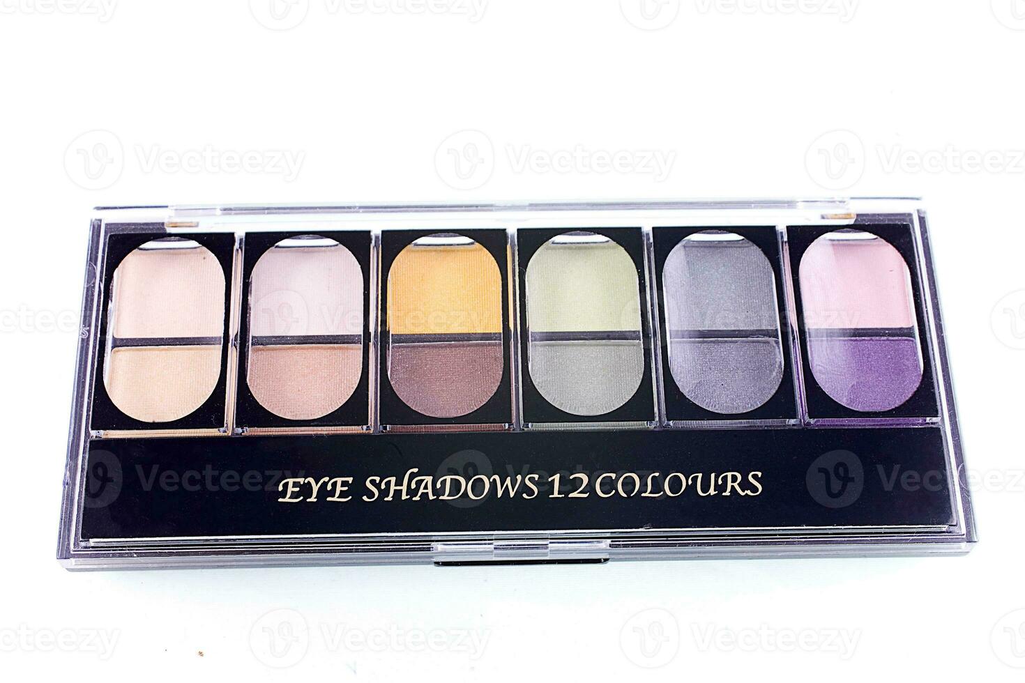 palette with colorful eye shadows on white isolated background photo