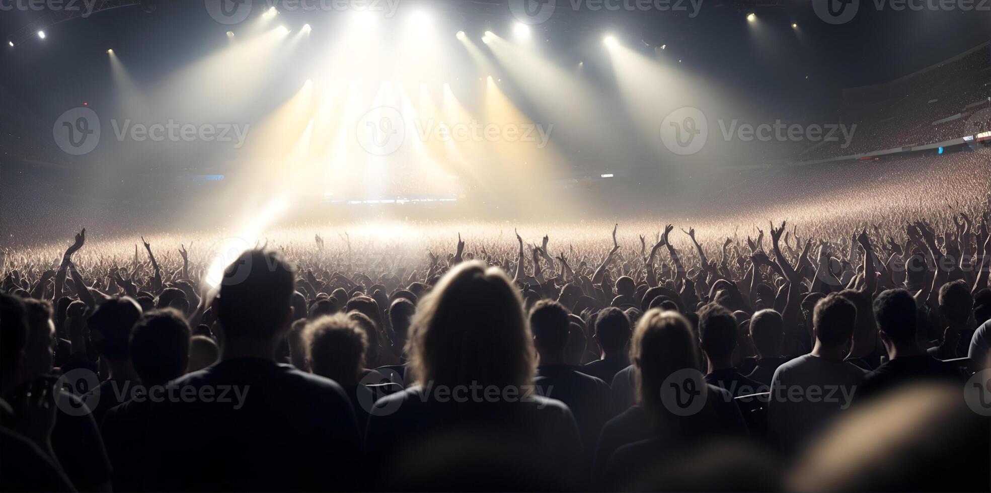 A crowd of people at a stadium rock concert, live event. photo