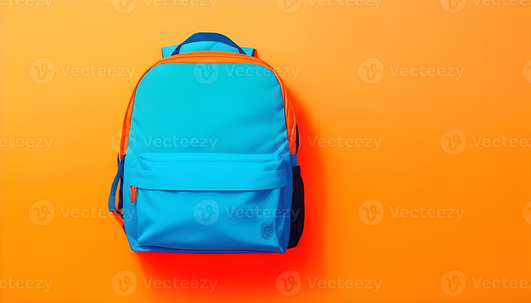 Blue backpack on orange background. Back to school. photo