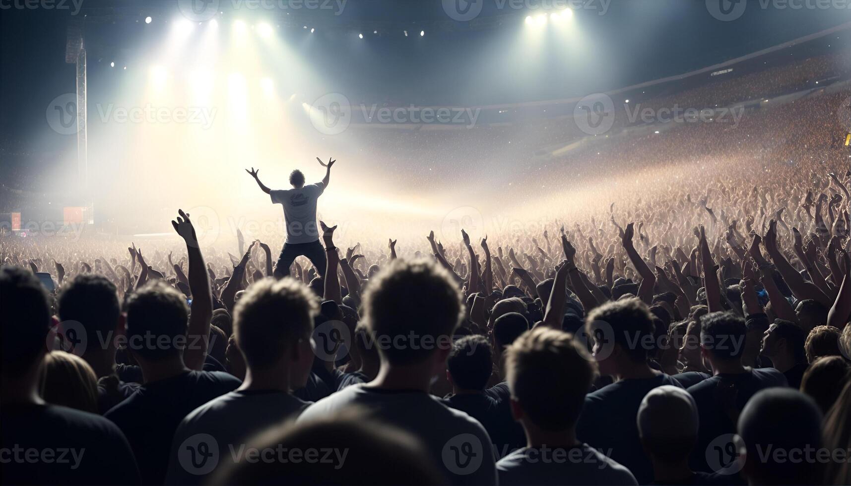 A crowd of people at a stadium rock concert, live event. photo