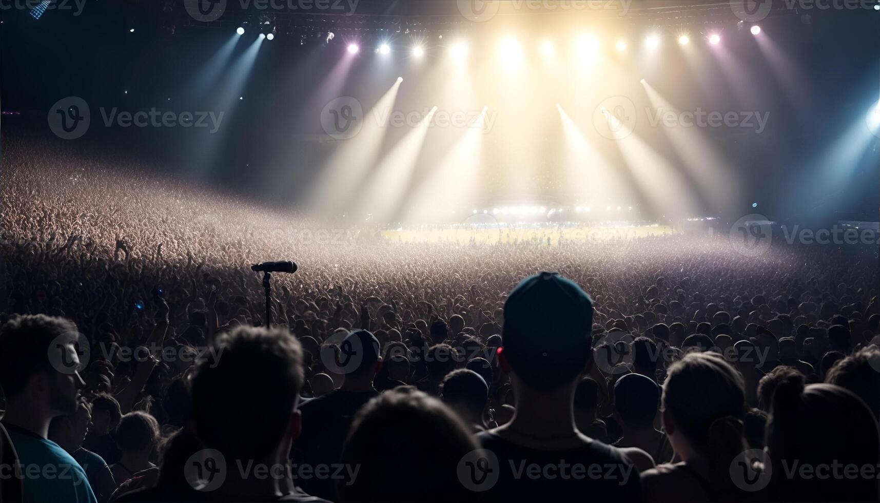 A crowd of people at a stadium rock concert, live event. photo