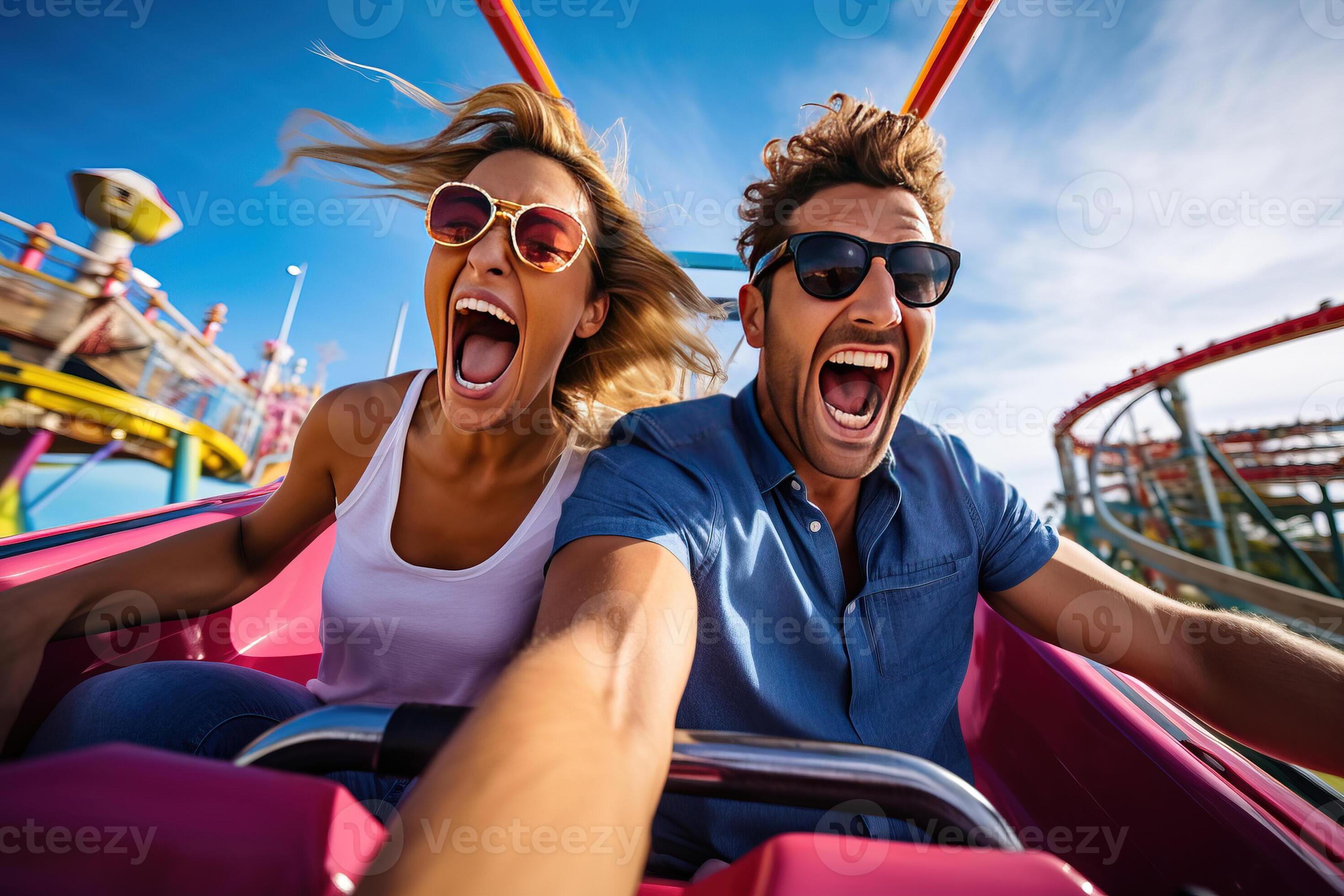 Excited couple enjoying a thrilling, high-speed ride at an amusement 