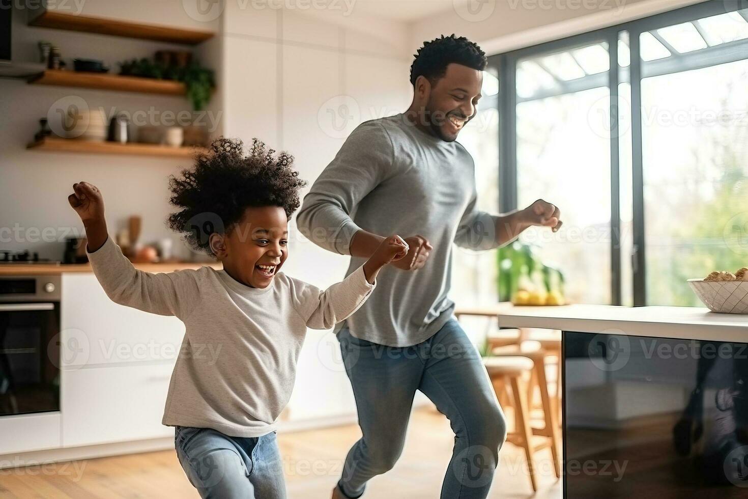 Happy african american family father and little son dancing on a kitchen. AI Generated photo