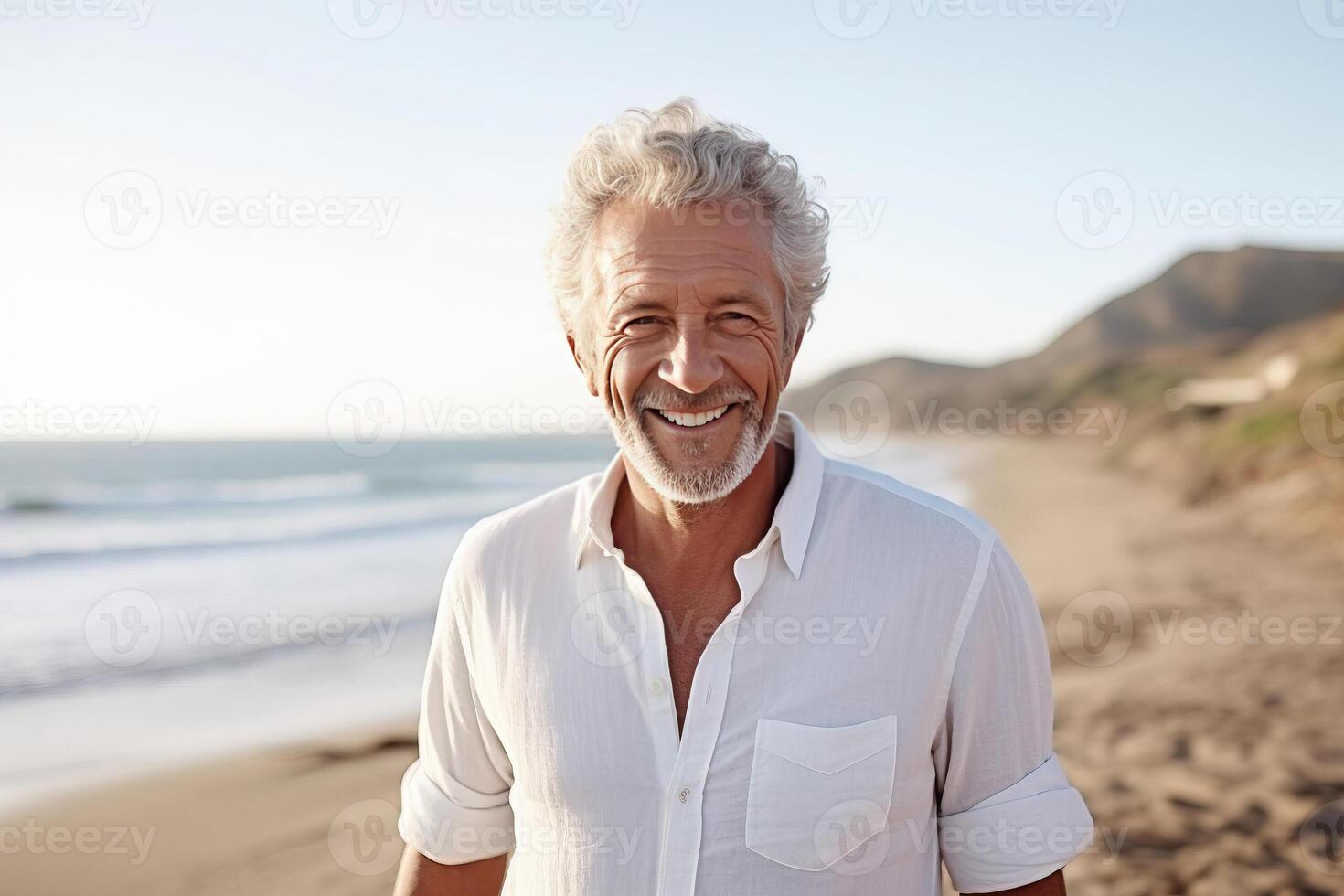 Happy mature senior man on beach coast . photo