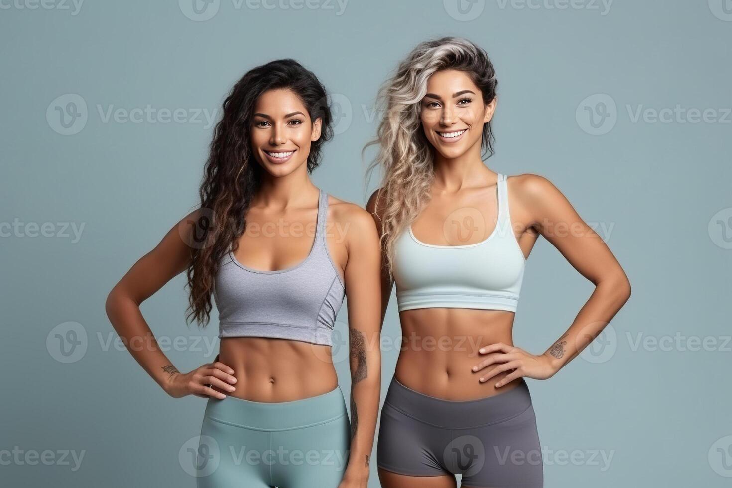 Two fit young women stand together in sportswear, embracing a healthy lifestyle in the studio clean background. AI Generated photo