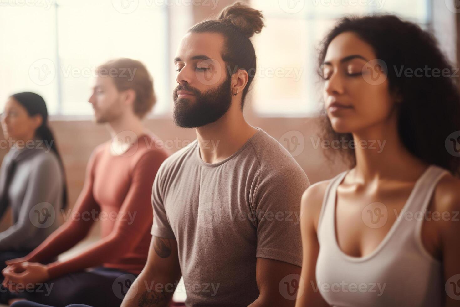 Group meditation in yoga studio, breath exercise, men and women meditating and breathing with closed eyes, breathwork concept. photo