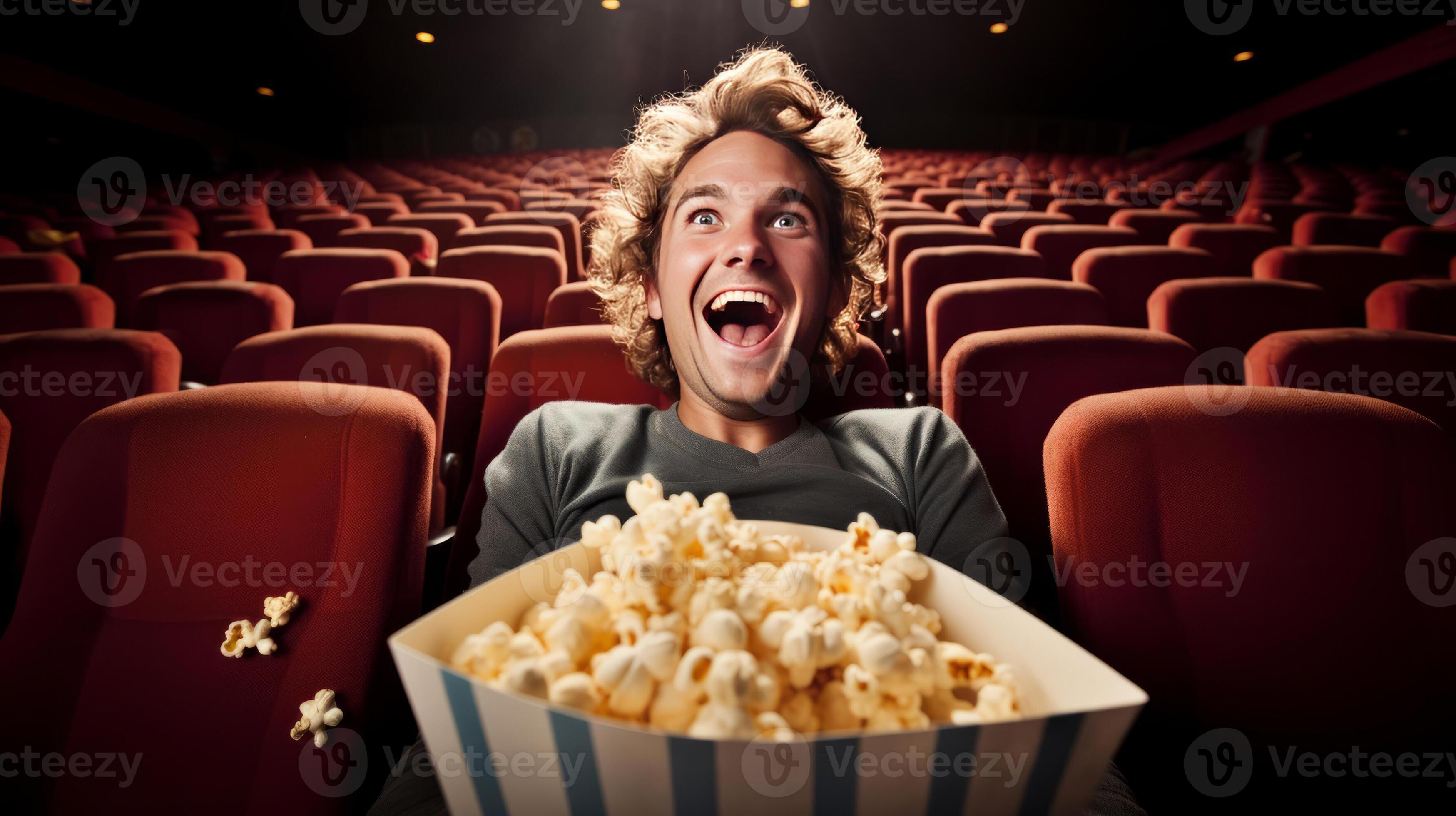 Man eating popcorn in a movie theater, sitting and eating popcorn. AI