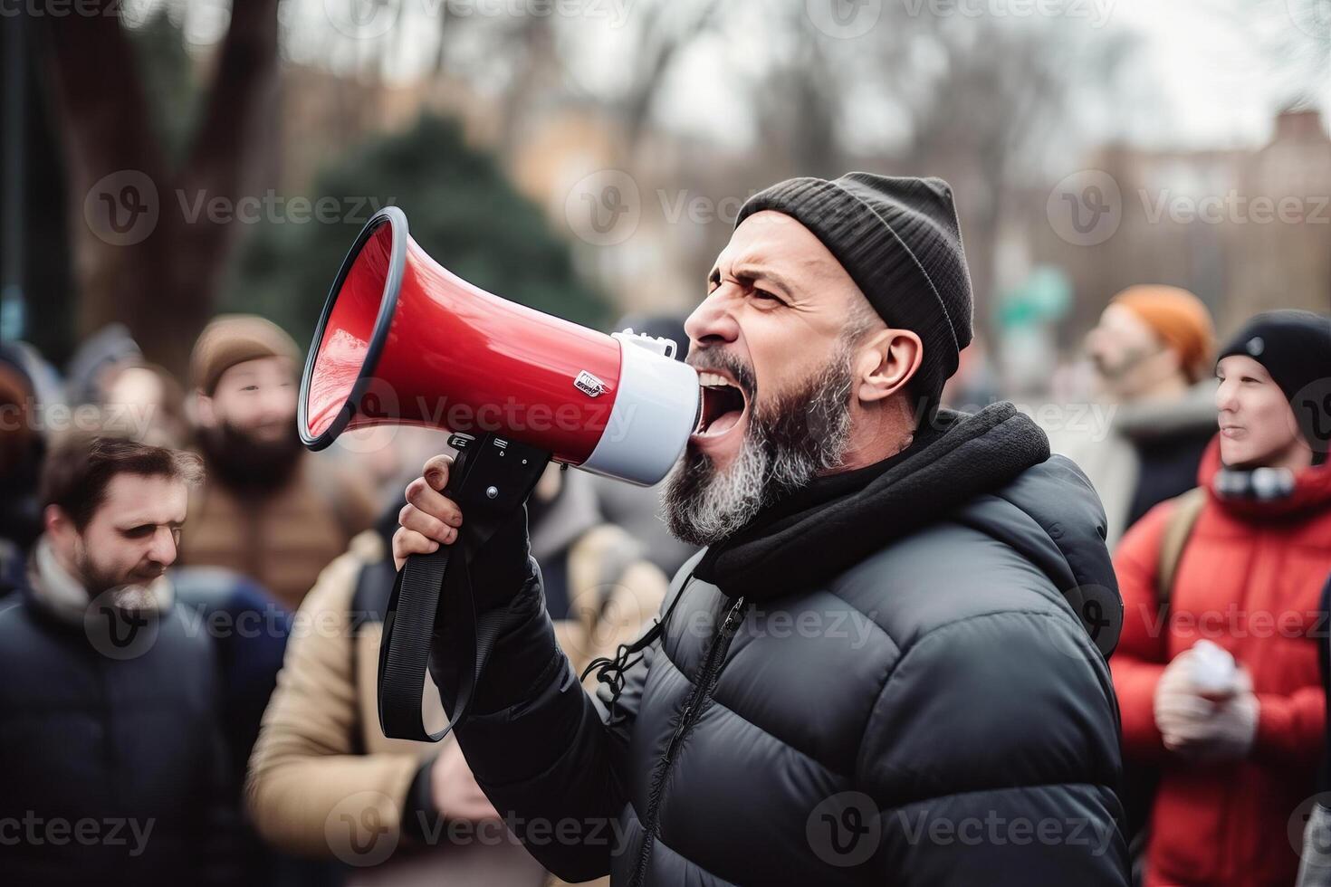 portrait of a man shouts into a megaphone during a protest. photo