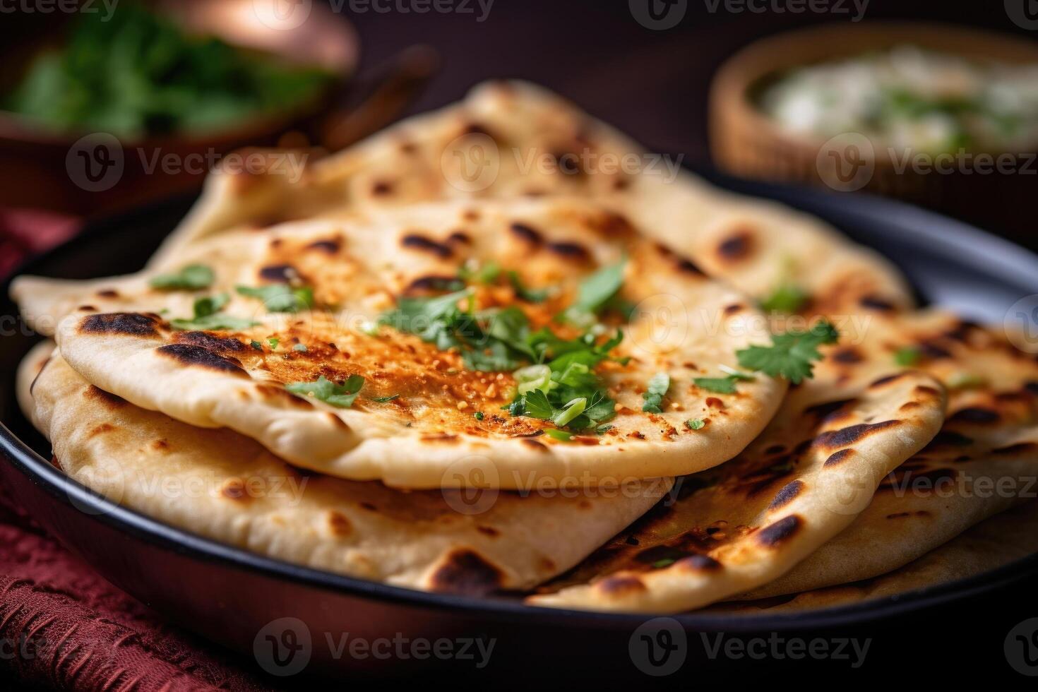 Naan bread in plate. Flatbread with spices. Indian cuisine. photo