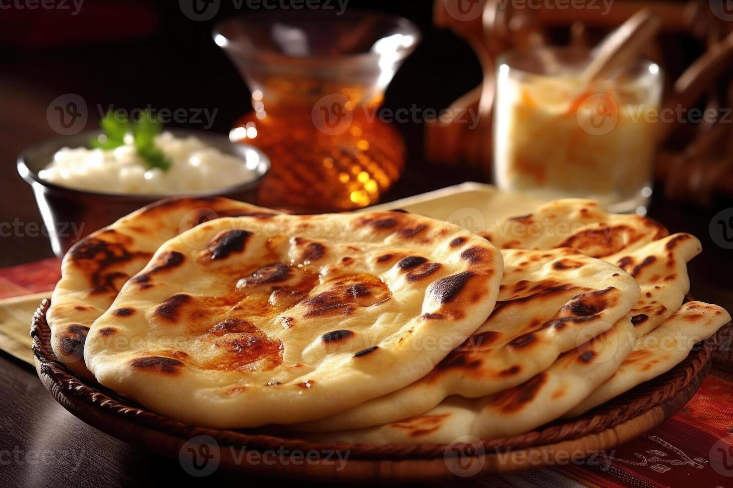 Naan bread in plate. Flatbread with spices. Indian cuisine. photo