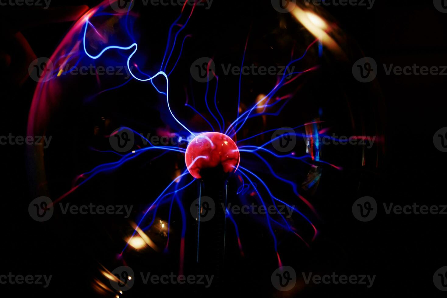 Plasma ball with energy rays on dark background photo