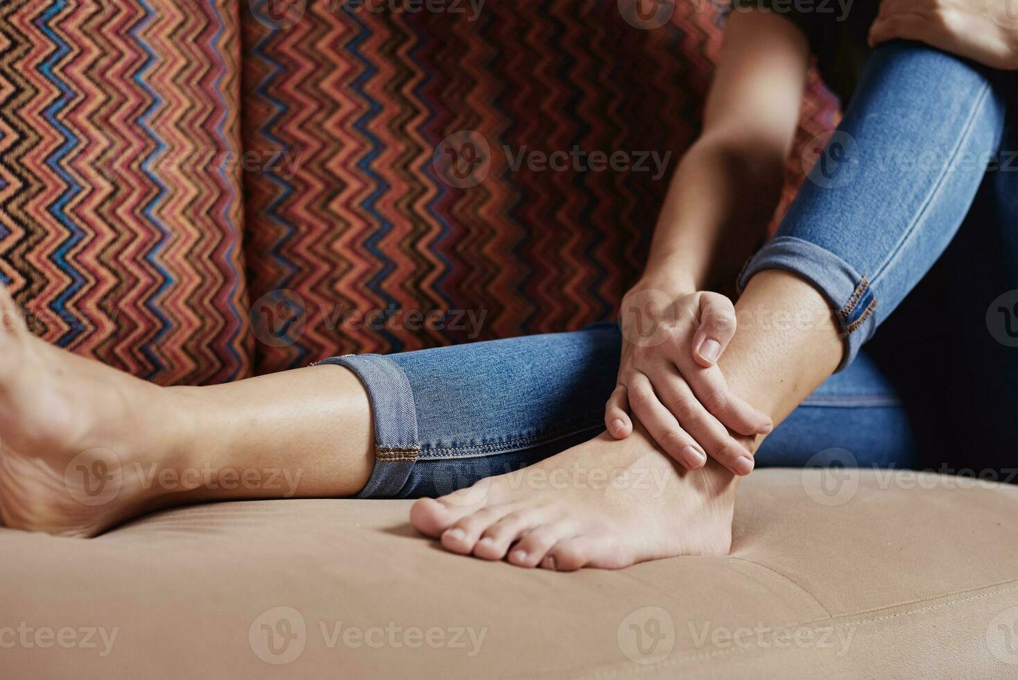 Woman have pain in leg, take ankle massage photo