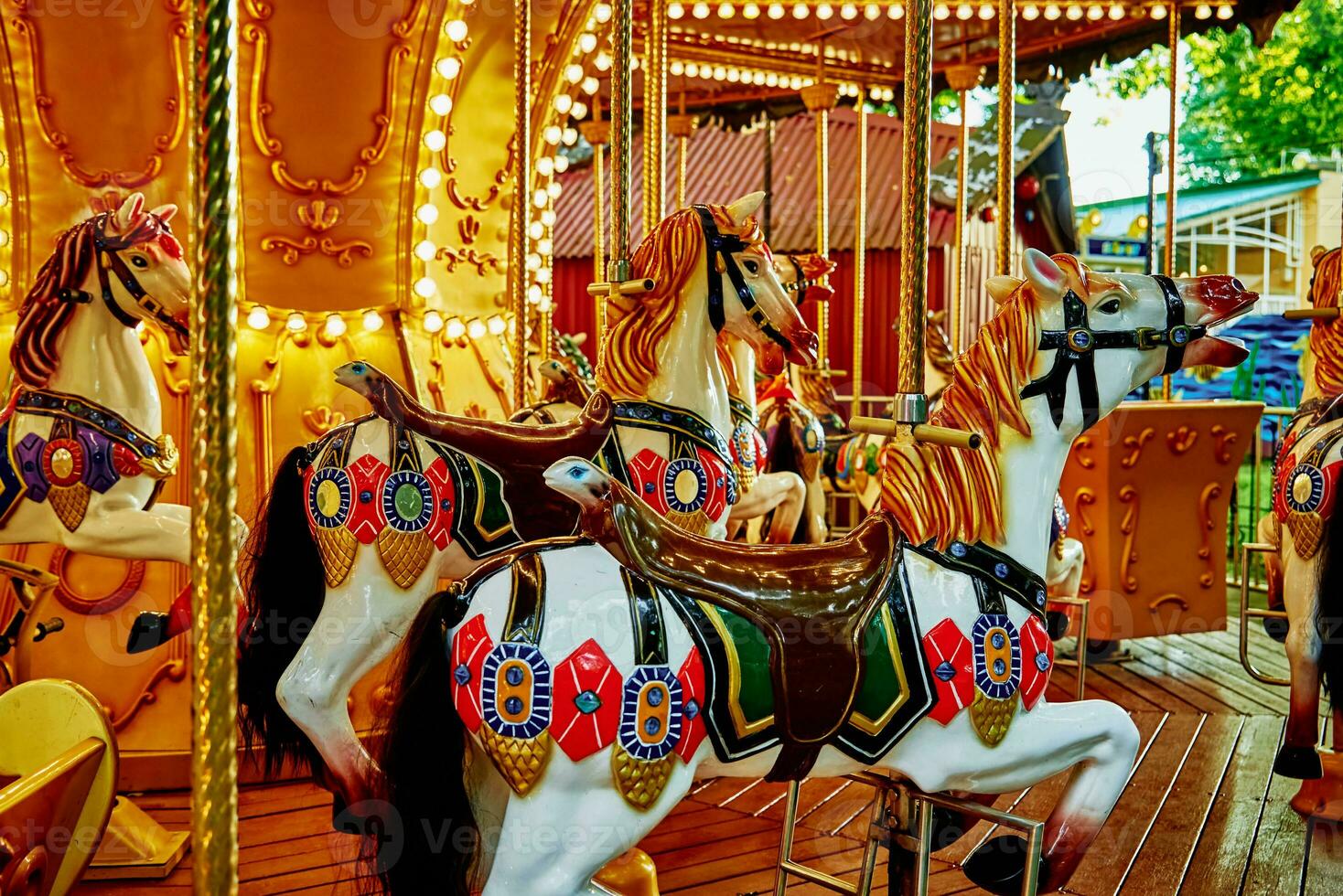 Horse carousel at amusement park photo