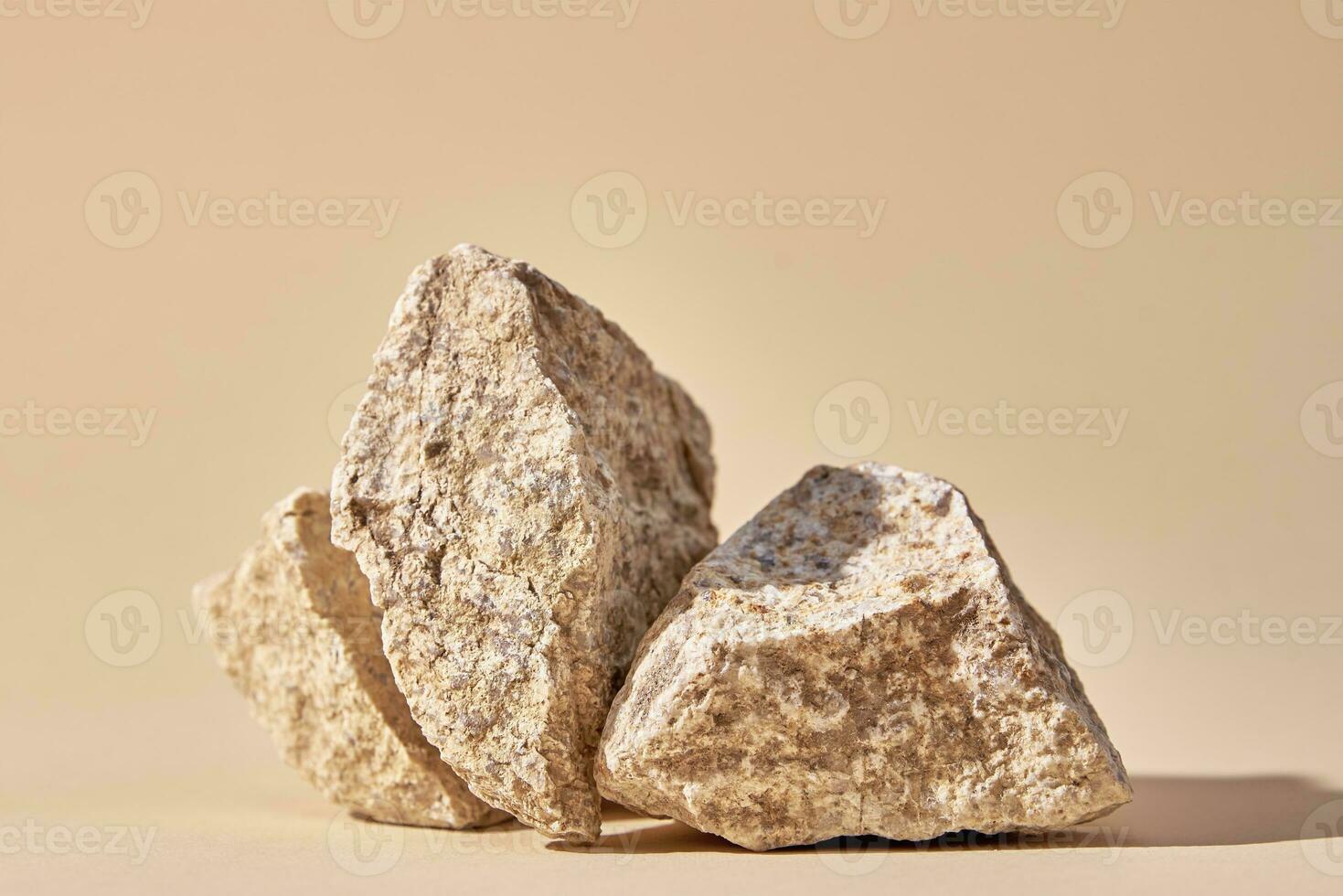 Natural granit stone on beige background photo