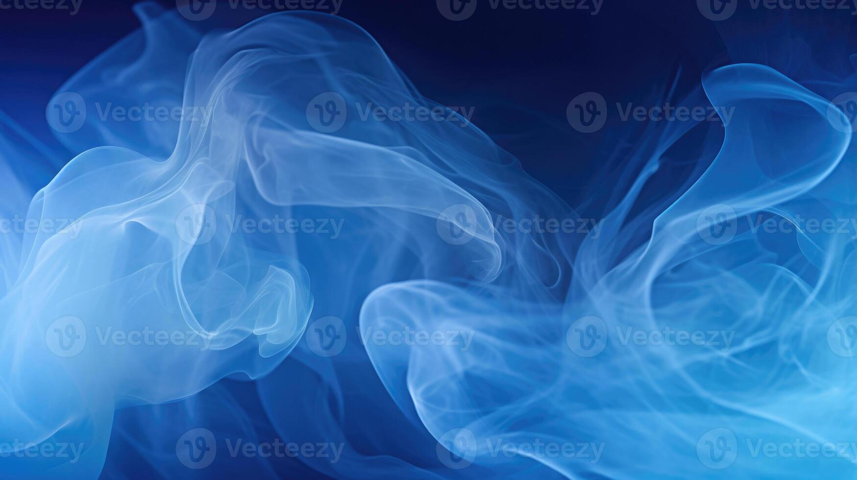 Smoke swirling effect. Ink drop in water on dark blue background. photo