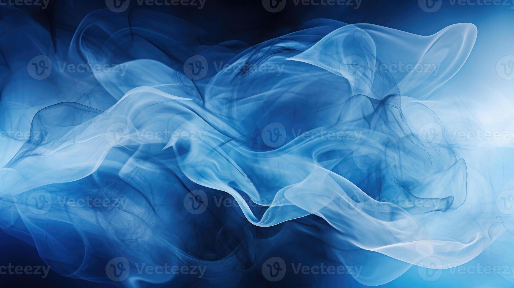 Smoke swirling effect. Ink drop in water on dark blue background. photo