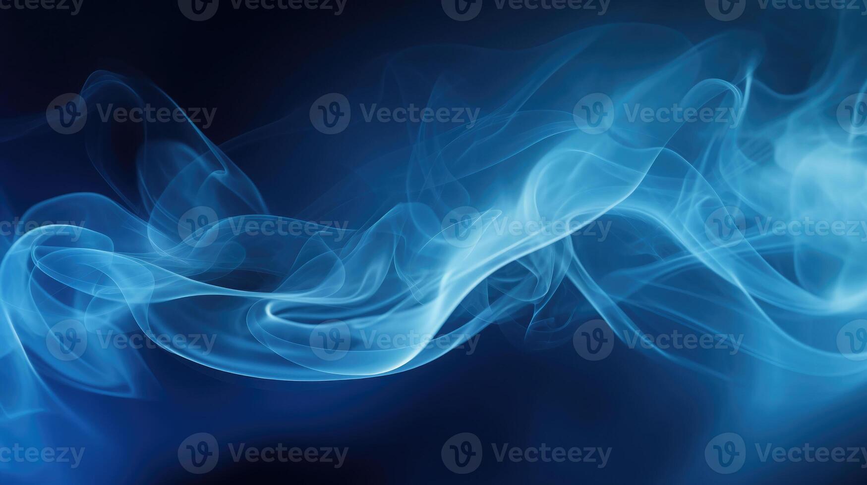 Smoke swirling effect. Ink drop in water on dark blue background. photo