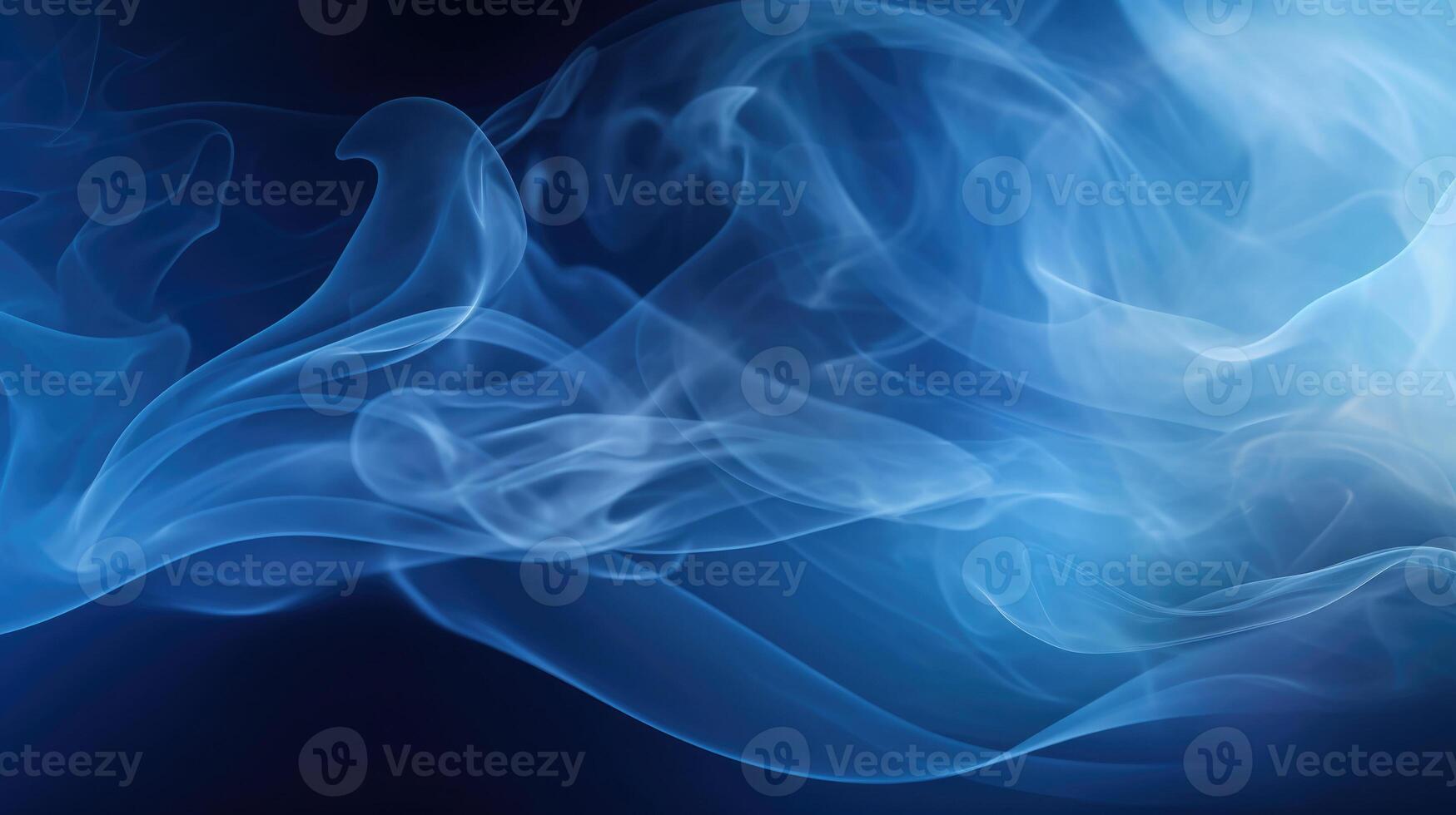 Smoke swirling effect. Ink drop in water on dark blue background. photo