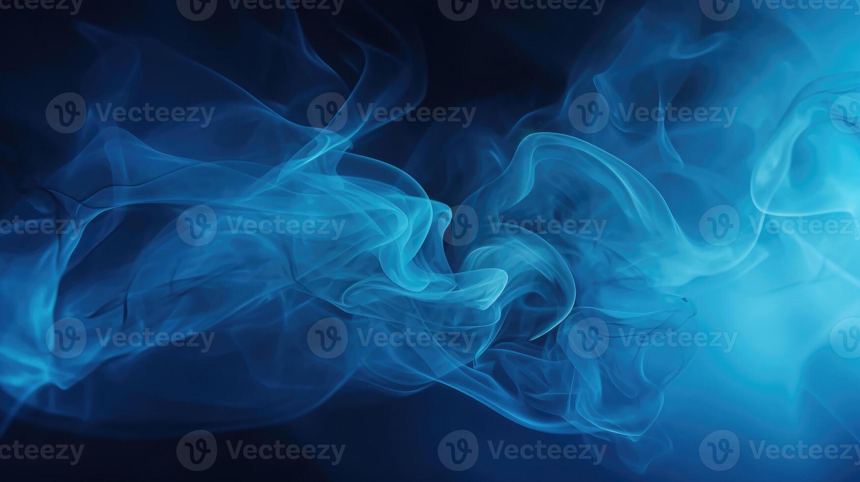 Smoke swirling effect. Ink drop in water on dark blue background. photo