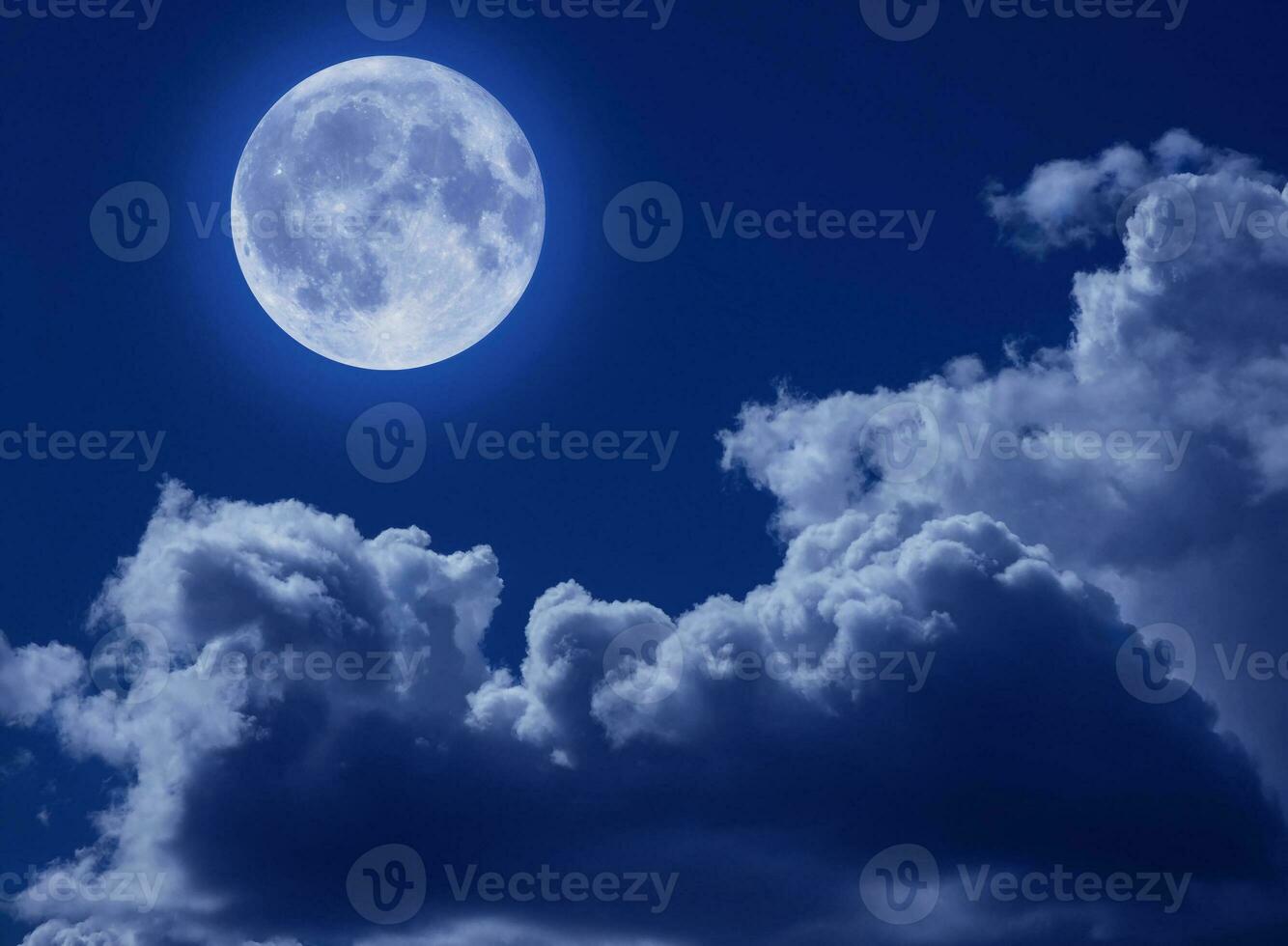 A full moon in a tragic night sky with clouds. A Halloween scene with a copy of the space. photo
