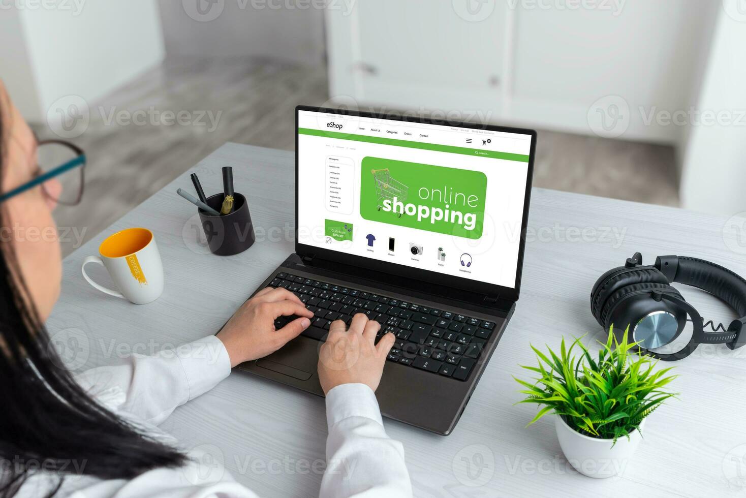 Online shopping laptop with business storefront. Woman use a laptop to search an ecommerce web site photo