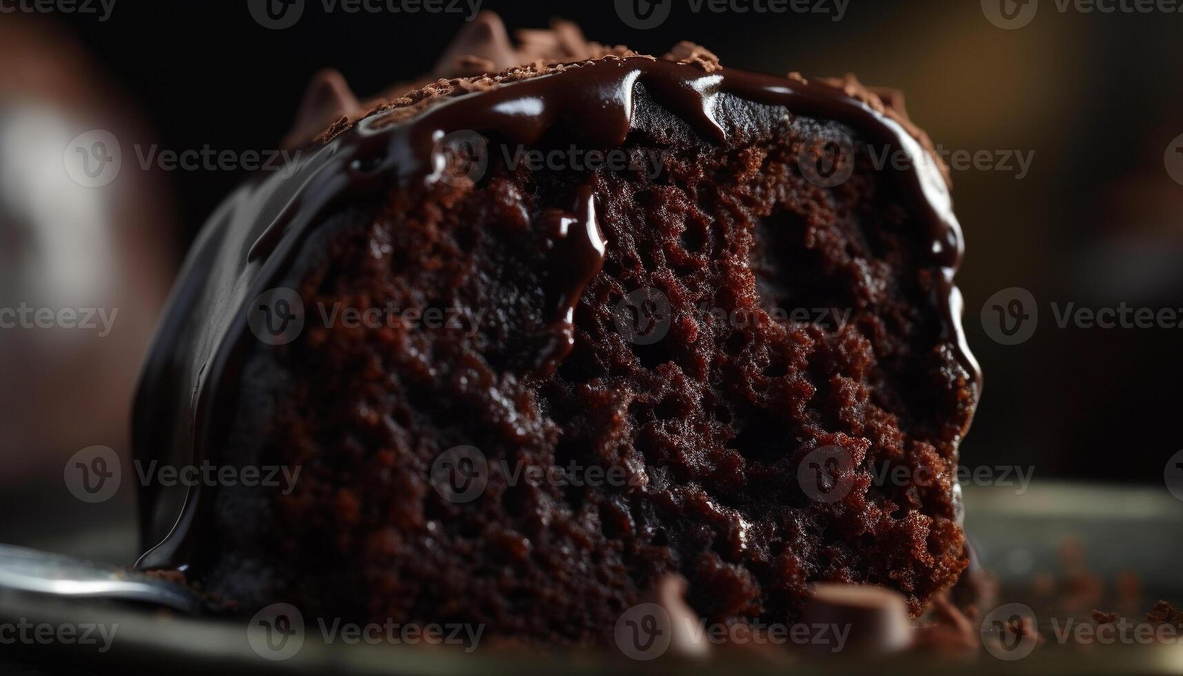 Indulgent chocolate chip muffin with rich dark chocolate icing drizzle