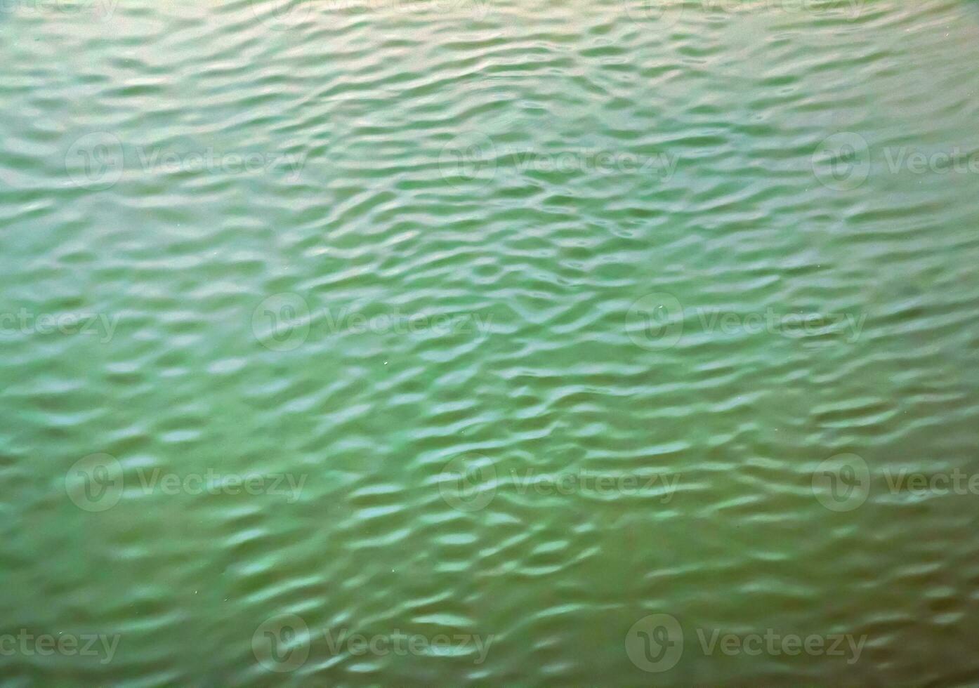 The texture of the water of the river. Natural water background with ripples and waves. photo