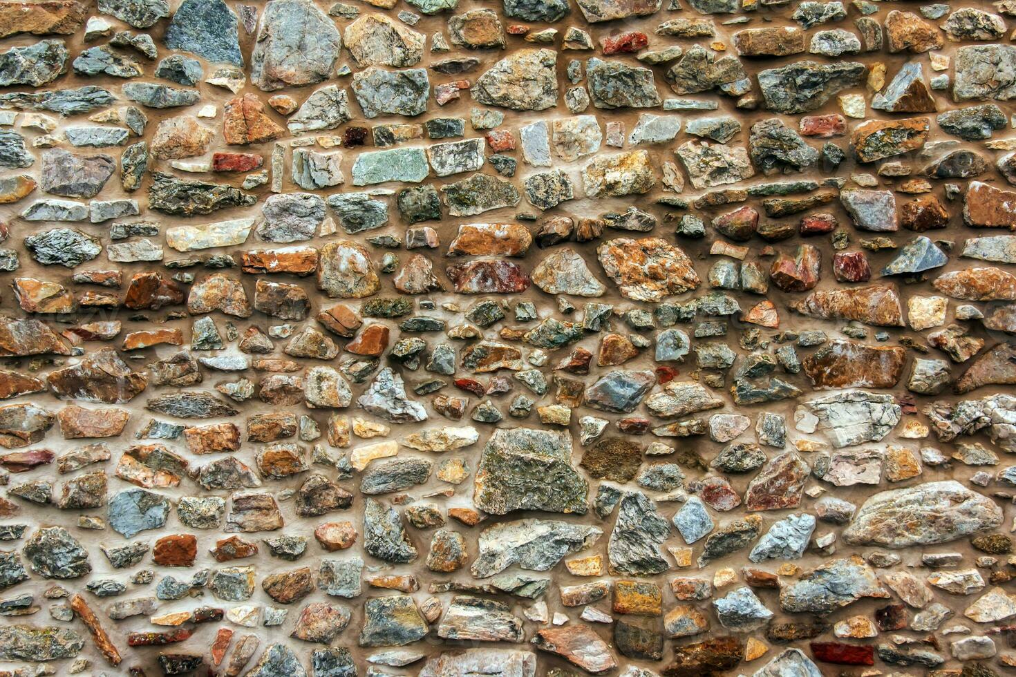 The texture of the stone wall. Background texture of the stone wall of the old castle. Stone wall as background or texture. photo
