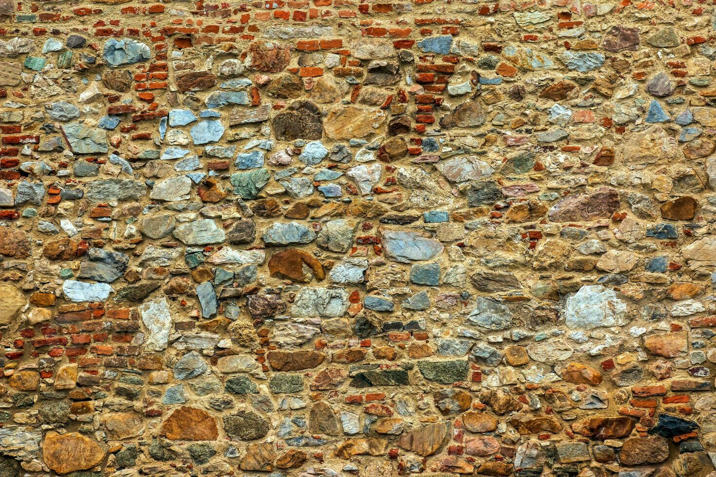 The texture of the stone wall. Background texture of the stone wall of the old castle. Stone wall as background or texture. photo