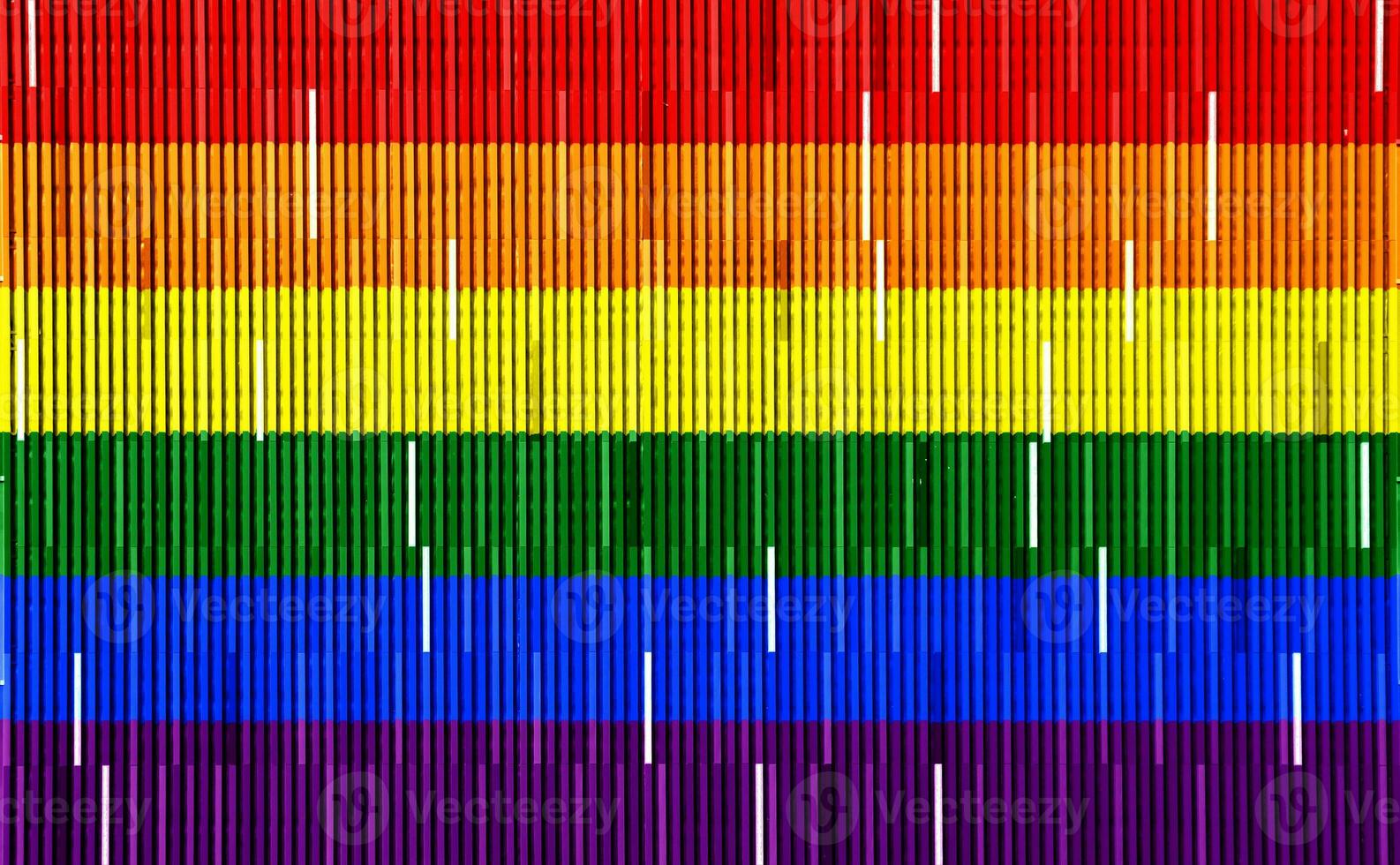 Flag of the LGBT community on the background of the wooden texture of the boards. Rainbow gay culture symbol. Concept collage. photo