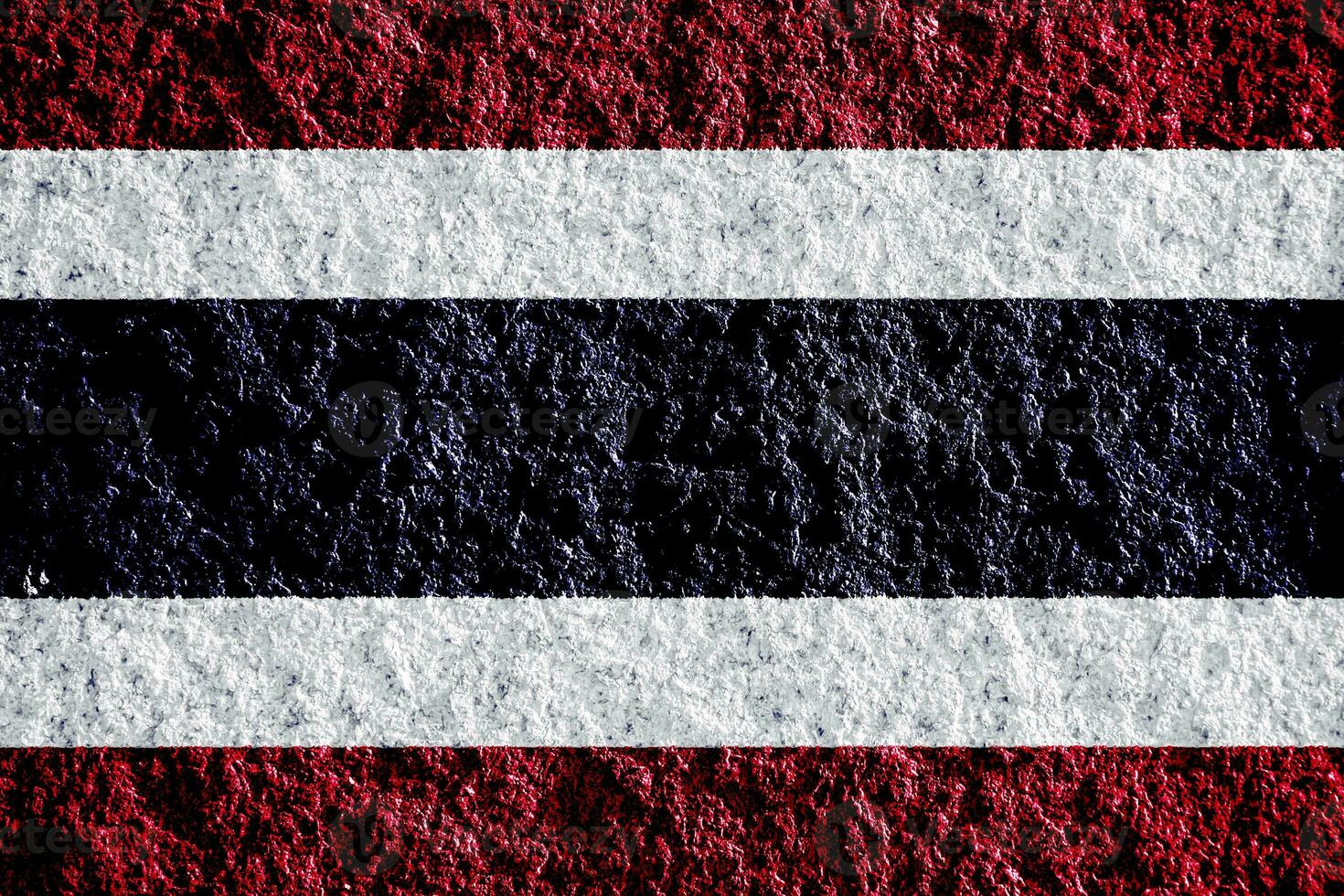 Flag of the Kingdom of Thailand on a textured background. Concept collage. photo